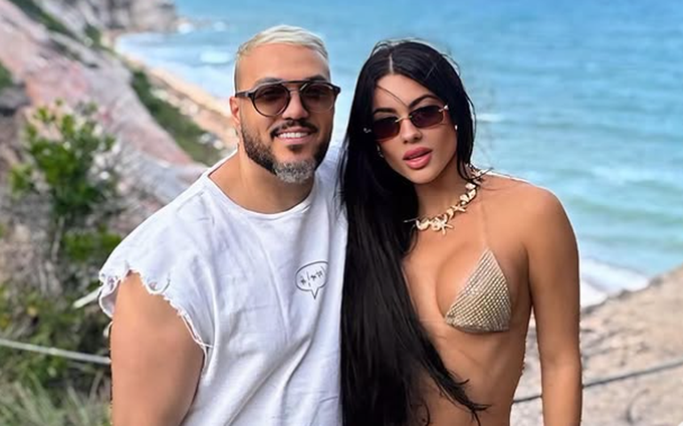 Belo fala pela primeira vez sobre namoro com Rayane Figliuzzi após ela ir para reality de confinamento: 'Relação ainda tá de pé'