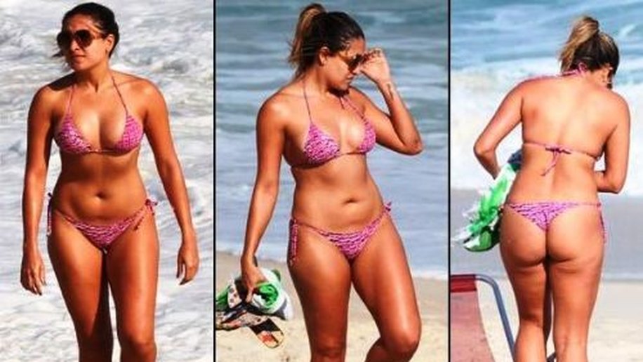 Ex-BBB Natalia exibe o corpo cheio de celulite em praia do Rio