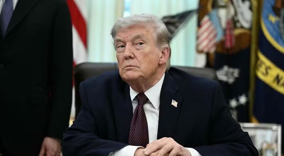 114436370-us-president-donald-trump-takes-a-question-from-a-reporter-after-signing-an-executive-orde