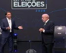 Os candidatos Flávio Bolsonaro e Luna no debate da Band. - Foto: Reprodução/Band