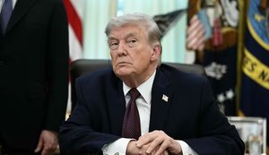 114436370-us-president-donald-trump-takes-a-question-from-a-reporter-after-signing-an-executive-orde