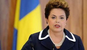Dilma presta apoio aos jogadores da seleção/ Getty Images