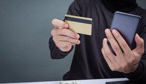 thieves-wear-black-hat-hold-phone-smart-card-gray-scaled