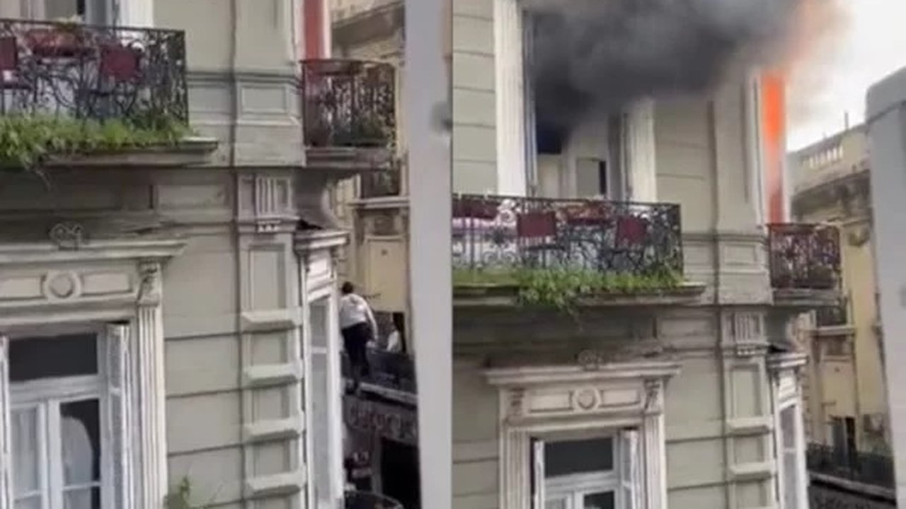 Prédio pega fogo na Argentina, e mulher se pendura em cabo para tentar escapar das chamas; vídeo